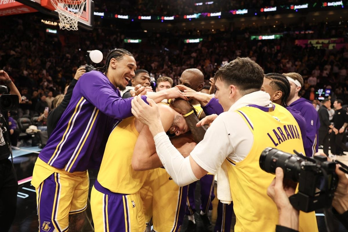 Mar 19, 2026; Miami, Florida, USA; Los Angeles Lakers team celebrates Luka Doncic (77) after 60 point game against the Miami Heat at Kaseya Center. Mandatory Credit: Isabella Frias-Imagn Images