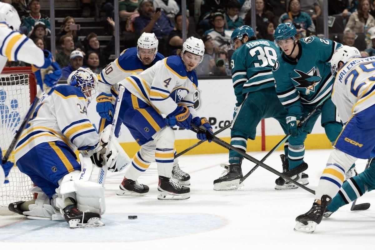 Mar 19, 2026; San Jose, California, USA; Buffalo Sabres goaltender Alex Lyon (34) blocks a shot on goal by San Jose Sharks center Will Smith (2) during the second period at SAP Center at San Jose. Mandatory Credit: D. Ross Cameron-Imagn Images