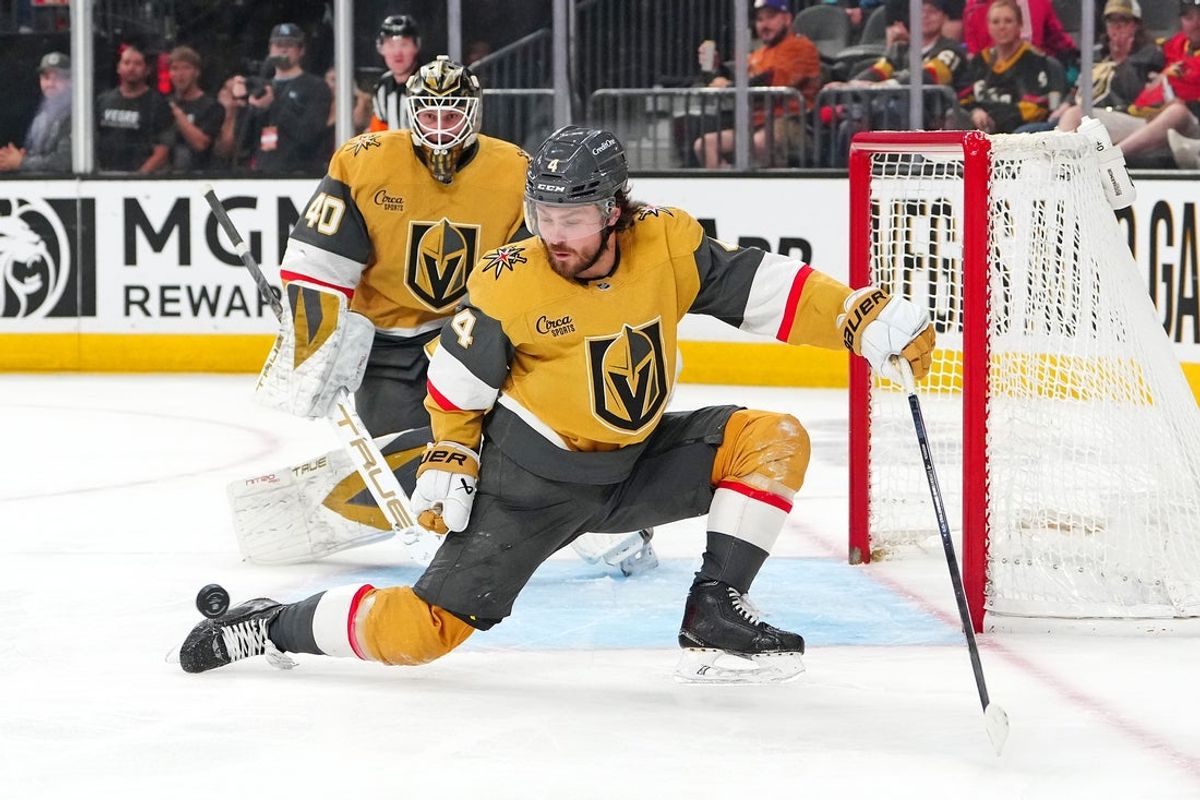 Mar 19, 2026; Las Vegas, Nevada, USA; Vegas Golden Knights defenseman Rasmus Andersson (4) looks to deflect a Utah Mammoth shot as goaltender Akira Schmid (40) returns to his net during the third period at T-Mobile Arena. Mandatory Credit: Stephen R. Sylvanie-Imagn Images