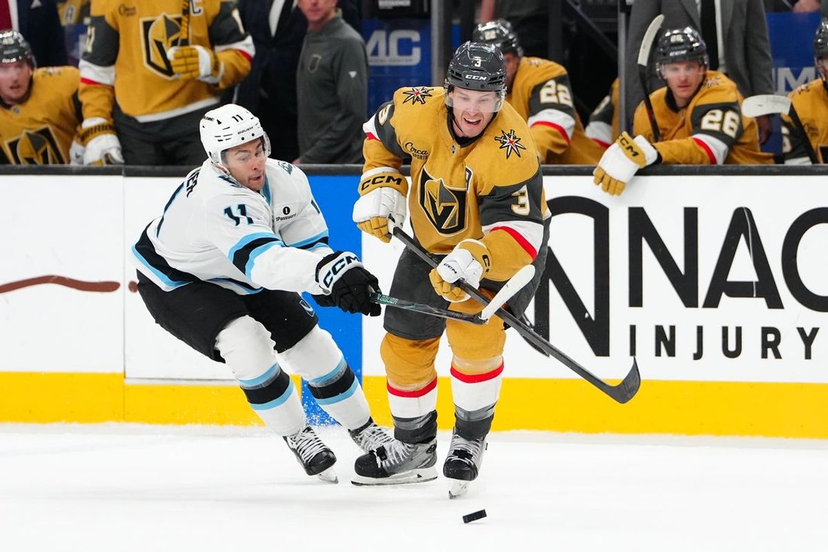 Mar 19, 2026; Las Vegas, Nevada, USA; Utah Mammoth right wing Dylan Guenther (11) slashes the stick of Vegas Golden Knights defenseman Brayden McNabb (3) during the second period at T-Mobile Arena. Mandatory Credit: Stephen R. Sylvanie-Imagn Images