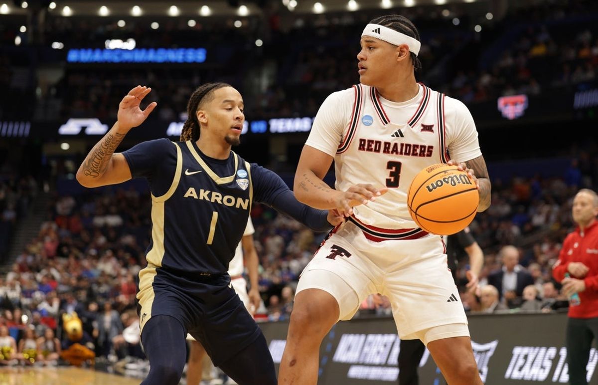 Mar 20, 2026; Tampa, FL, USA; Texas Tech Red Raiders forward Lejuan Watts (3) drives against Akron Zips guard Shammah Scott (1) in the second half during a first round game of the men's 2026 NCAA Tournament at Benchmark International Arena. Mandatory Credit: Nathan Ray Seebeck-Imagn Images