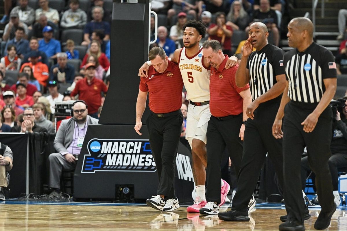 Mar 20, 2026; St. Louis, MO, USA; Iowa State Cyclones forward Joshua Jefferson (5) is helped off of the court after suffering an apparent injury to his left leg while shooting a layup against Tennessee State Tigers forward Jalen Pitre (not pictured) during the first half of a first round game of the men's 2026 NCAA Tournament at Enterprise Center. Mandatory Credit: Jeff Le-Imagn Images