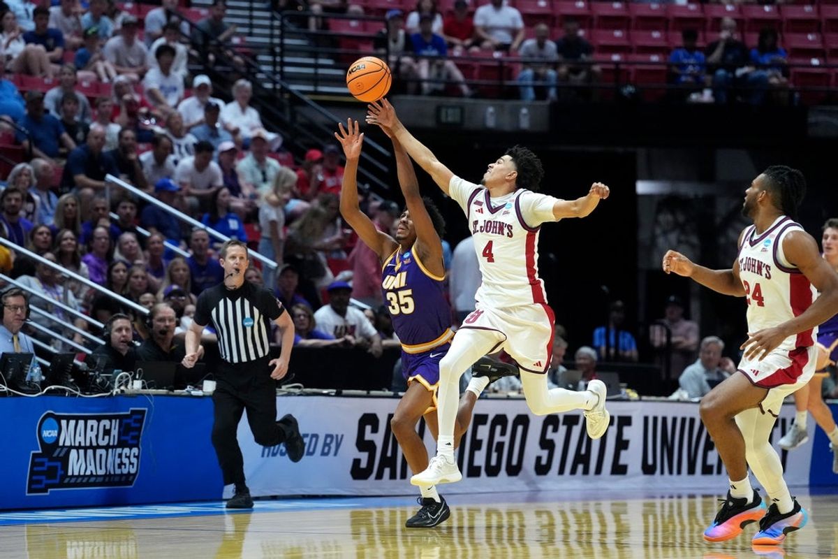 Mar 20, 2026; San Diego, CA, USA; St. John's Red Storm guard Oziyah Sellers (4) and Northern Iowa Panthers forward Leon Bond III (35) reach for the loose ball in the first half during a first round game of the men's 2026 NCAA Tournament at Viejas Arena. Mandatory Credit: Kirby Lee-Imagn Images