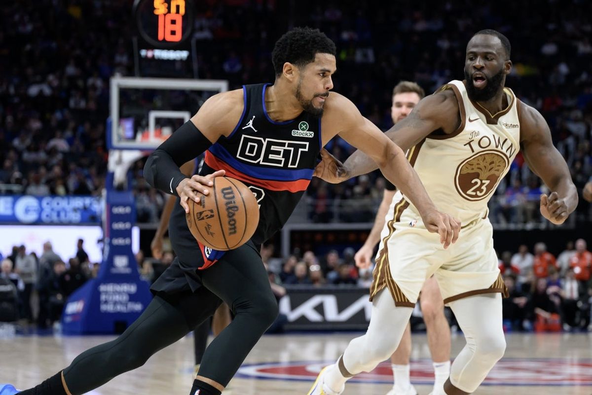Mar 20, 2026; Detroit, Michigan, USA;  Detroit Pistons forward Tobias Harris (12) drives past Golden State Warriors forward Draymond Green (23) in the first half at Little Caesars Arena. Mandatory Credit: Lon Horwedel-Imagn Images