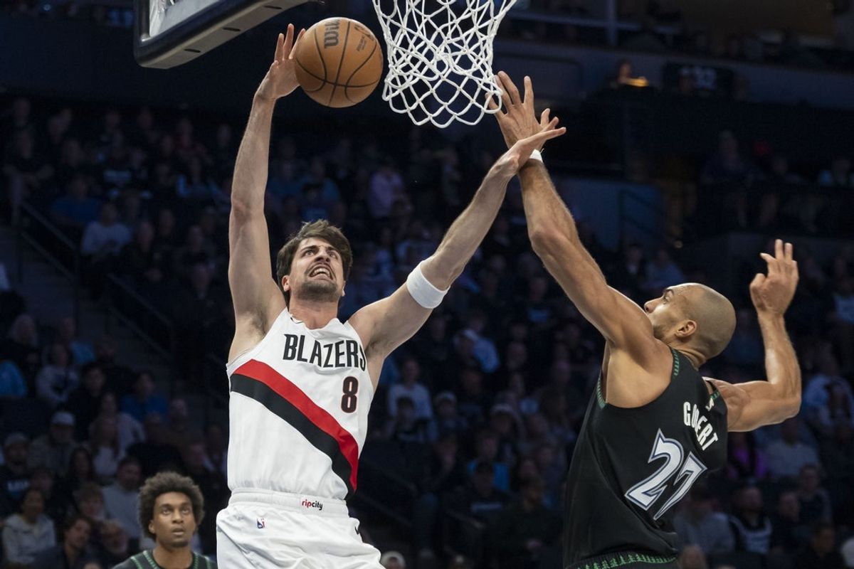 Mar 20, 2026; Minneapolis, Minnesota, USA; Portland Trail Blazers forward Deni Avdija (8) shoots the ball over past Minnesota Timberwolves center Rudy Gobert (27) in the first half at Target Center. Mandatory Credit: Jesse Johnson-Imagn Images