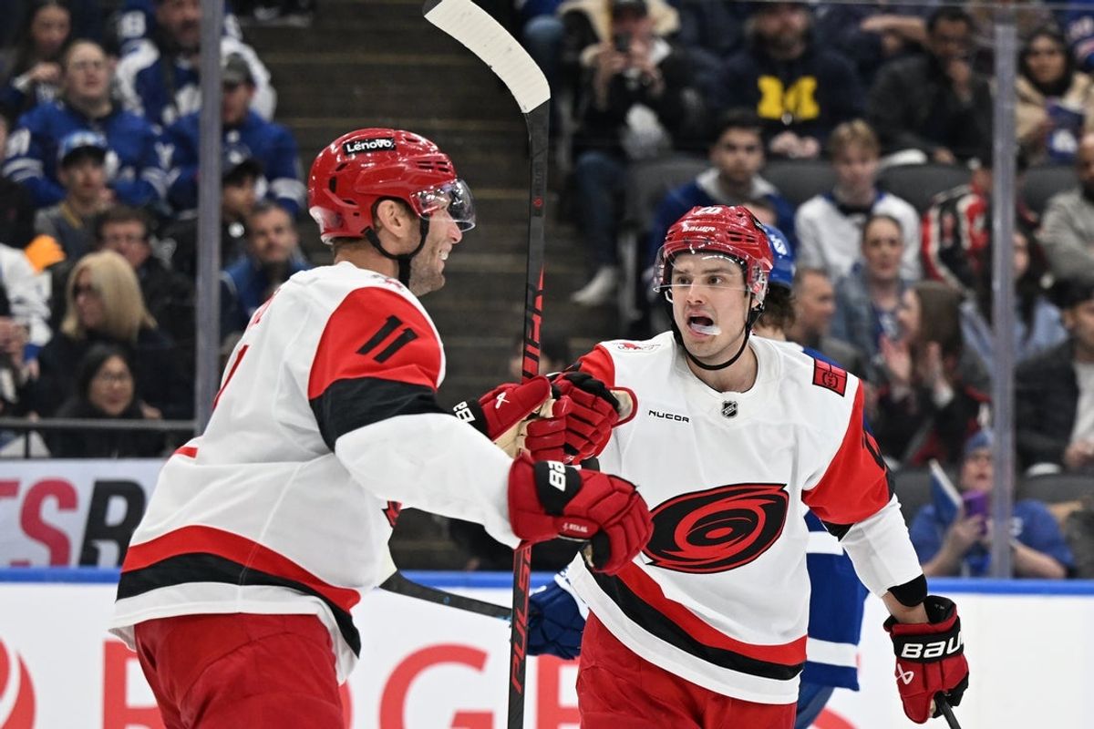 Mar 20, 2026; Toronto, Ontario, CAN;  Carolina Hurricanes forward Jordan Staal (11) celebrates with forward Sebastian Aho (20) after scoring a goal against the Toronto Maple Leafs in the second period at Scotiabank Arena. Mandatory Credit: Dan Hamilton-Imagn Images