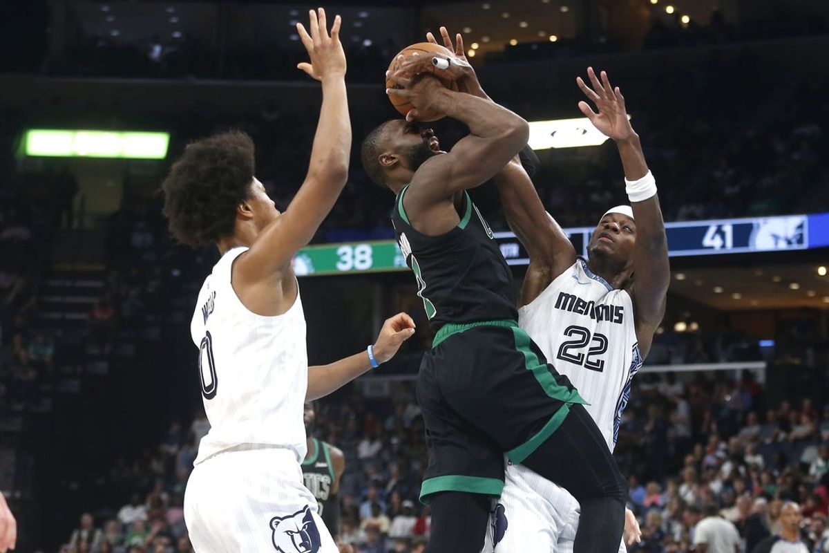 Mar 20, 2026; Memphis, Tennessee, USA; Boston Celtics guard Jaylen Brown (7) shoots as Memphis Grizzlies forward Taylor Hendricks (22) defends during the second quarter at FedExForum. Mandatory Credit: Petre Thomas-Imagn Images