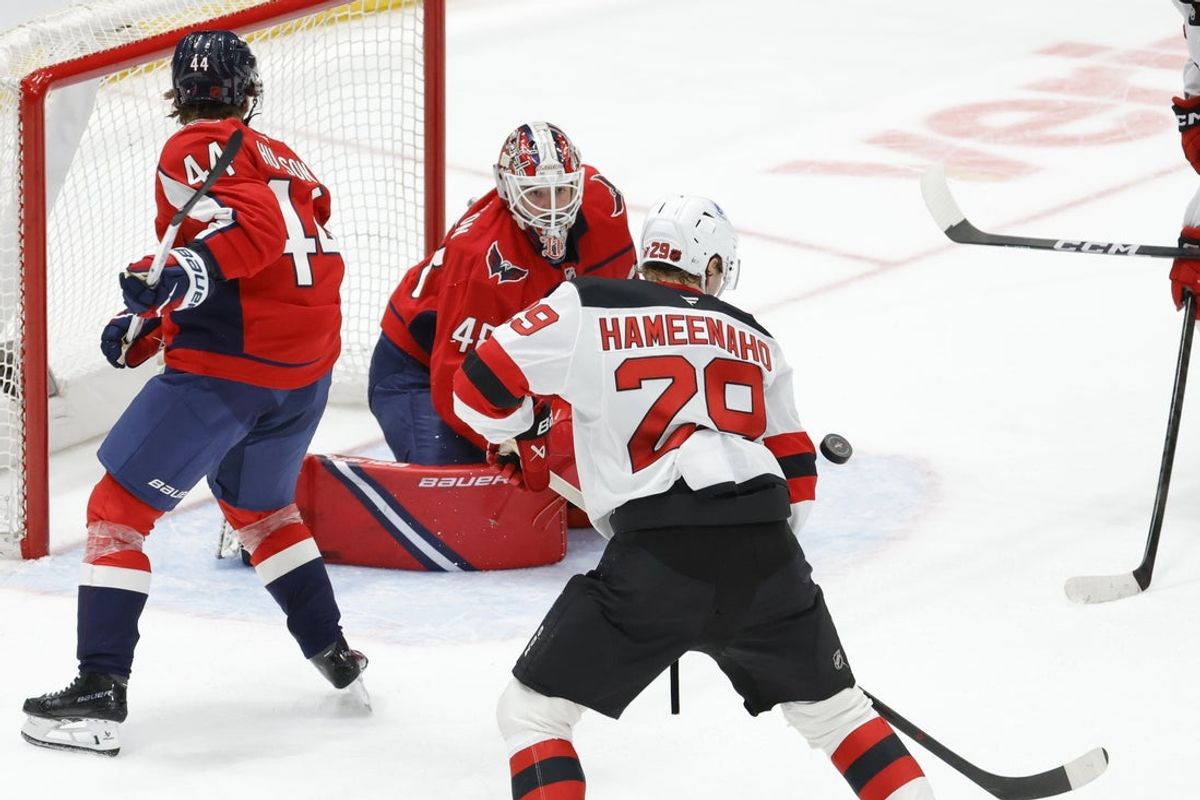 Mar 20, 2026; Washington, District of Columbia, USA; Washington Capitals goaltender Logan Thompson (48) watches the puck against New Jersey Devils right wing Lenni Hameenaho (29) during the third period at Capital One Arena. Mandatory Credit: Amber Searls-Imagn Images
