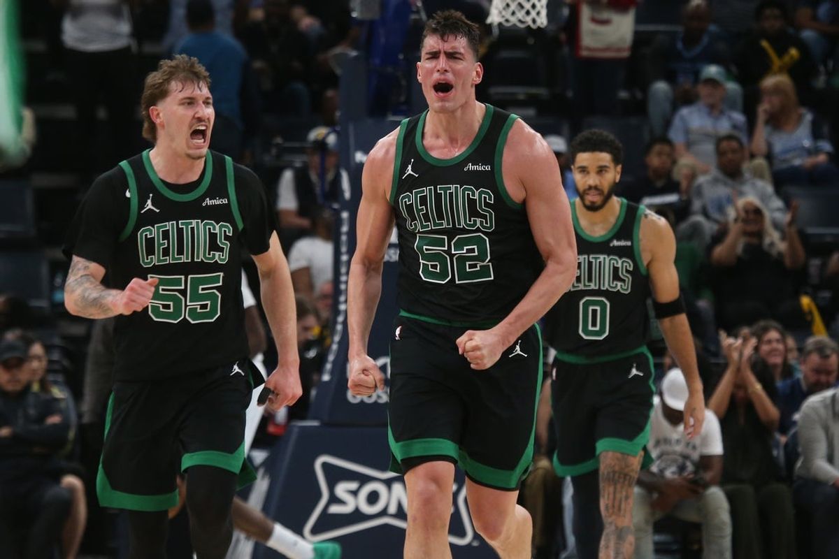 Mar 20, 2026; Memphis, Tennessee, USA; Boston Celtics guard Baylor Scheierman (55) and center Luka Garza (52) react during the fourth quarter against the Memphis Grizzlies at FedExForum. Mandatory Credit: Petre Thomas-Imagn Images