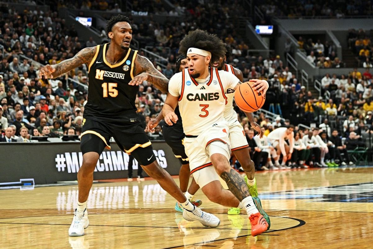 Mar 20, 2026; St. Louis, MO, USA; Miami (FL) Hurricanes guard Tre Donaldson (3) drives to the basket as Missouri Tigers center Shawn Phillips Jr. (15) defends during the second half during a first round game of the men's 2026 NCAA Tournament at Enterprise Center. Mandatory Credit: Jeff Le-Imagn Images