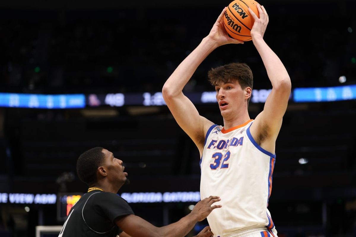 Mar 20, 2026; Tampa, FL, USA; Florida Gators center Olivier Rioux (32) looks to pass in the second half against the Prairie View A&M Panthers during a first round game of the men's 2026 NCAA Tournament at Benchmark International Arena. Mandatory Credit: Matt Pendleton-Imagn Images