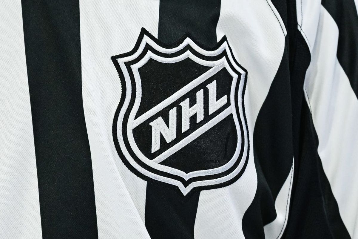 Mar 14, 2026; Montreal, Quebec, CAN; View of an NHL logo on a jersey worn by a linesman during the third period at Bell Centre. Mandatory Credit: David Kirouac-Imagn Images