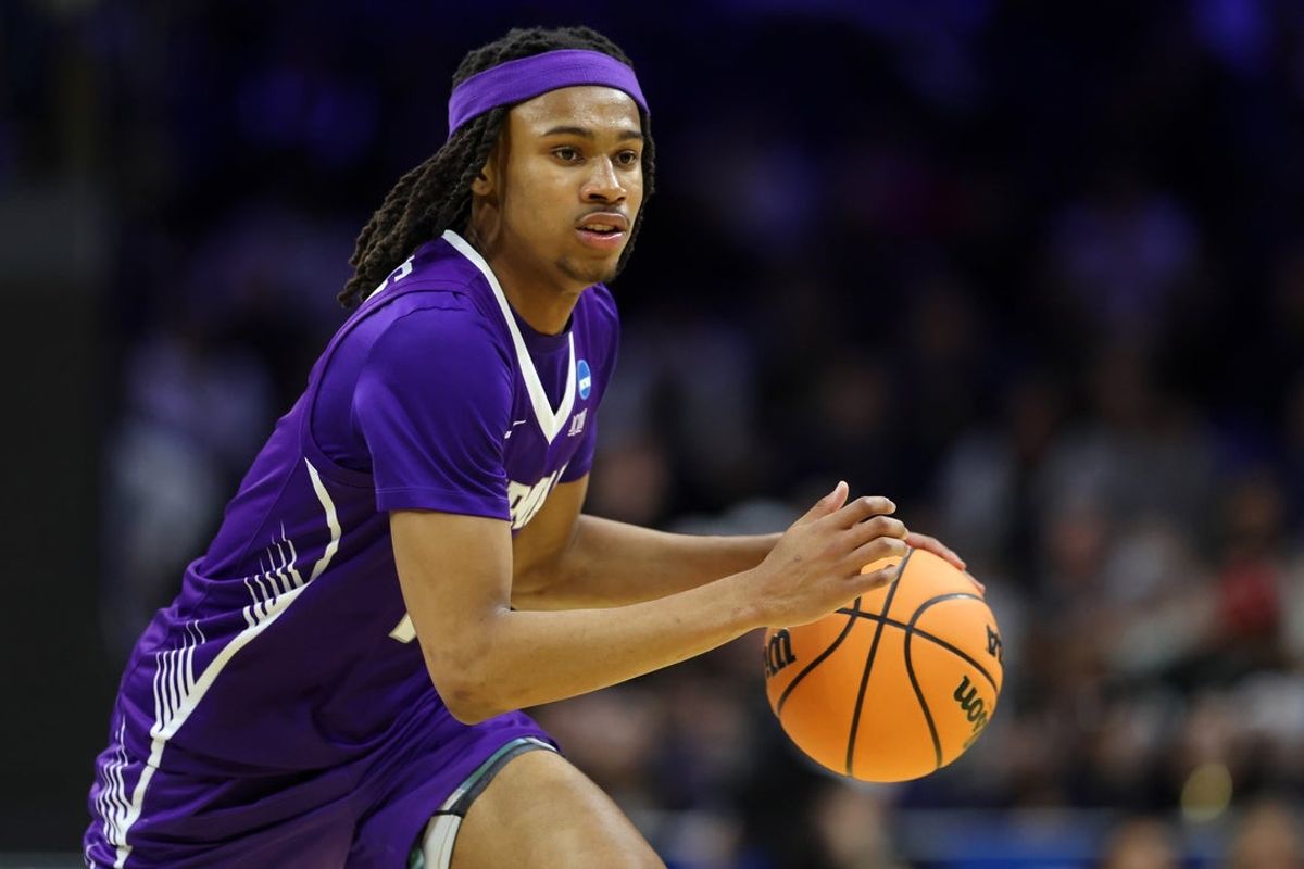 Mar 20, 2026; Philadelphia, PA, USA; Furman Paladins guard Alex Wilkins (10) dribbles the ball against the UConn Huskies in the second half during a first round game of the men's 2026 NCAA Tournament at Xfinity Mobile Arena. Mandatory Credit: Bill Streicher-Imagn Images