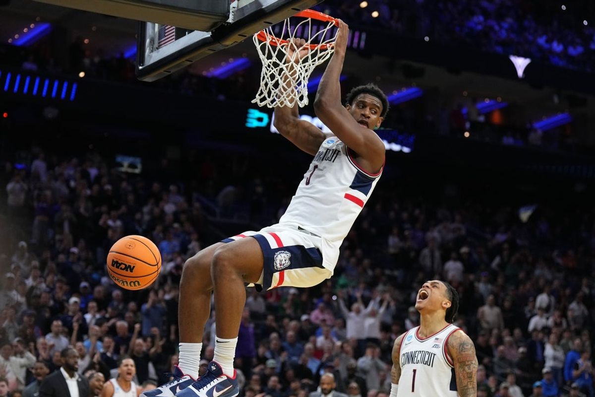 Mar 20, 2026; Philadelphia, PA, USA; UConn Huskies forward Tarris Reed Jr. (5) dunks the ball in the second half during a first round game of the men's 2026 NCAA Tournament at Xfinity Mobile Arena. Mandatory Credit: Kyle Ross-Imagn Images