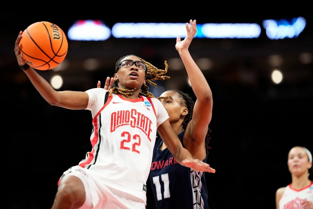 Ohio State Buckeyes guard Jaloni Cambridge (22) shoots in front of Howard Bison forward Sa'lah Hemingway (11) during the first round of the NCAA women's basketball tournament at the Jerome Schottenstein Center in Columbus on March 21, 2026.