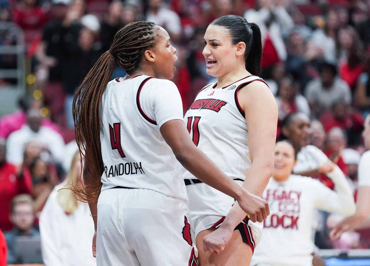 Louisville Cardinals forward MacKenly Randolph (4) celebrates after scoring plus drawing with teammate Louisville Cardinals forward Elif Istanbulluoglu (11) during the game against Vermont at the 2026 NCAA Women's March Madness basketball tournament at the KFC Yum Center In Louisville, Kentucky. March 21, 2026.