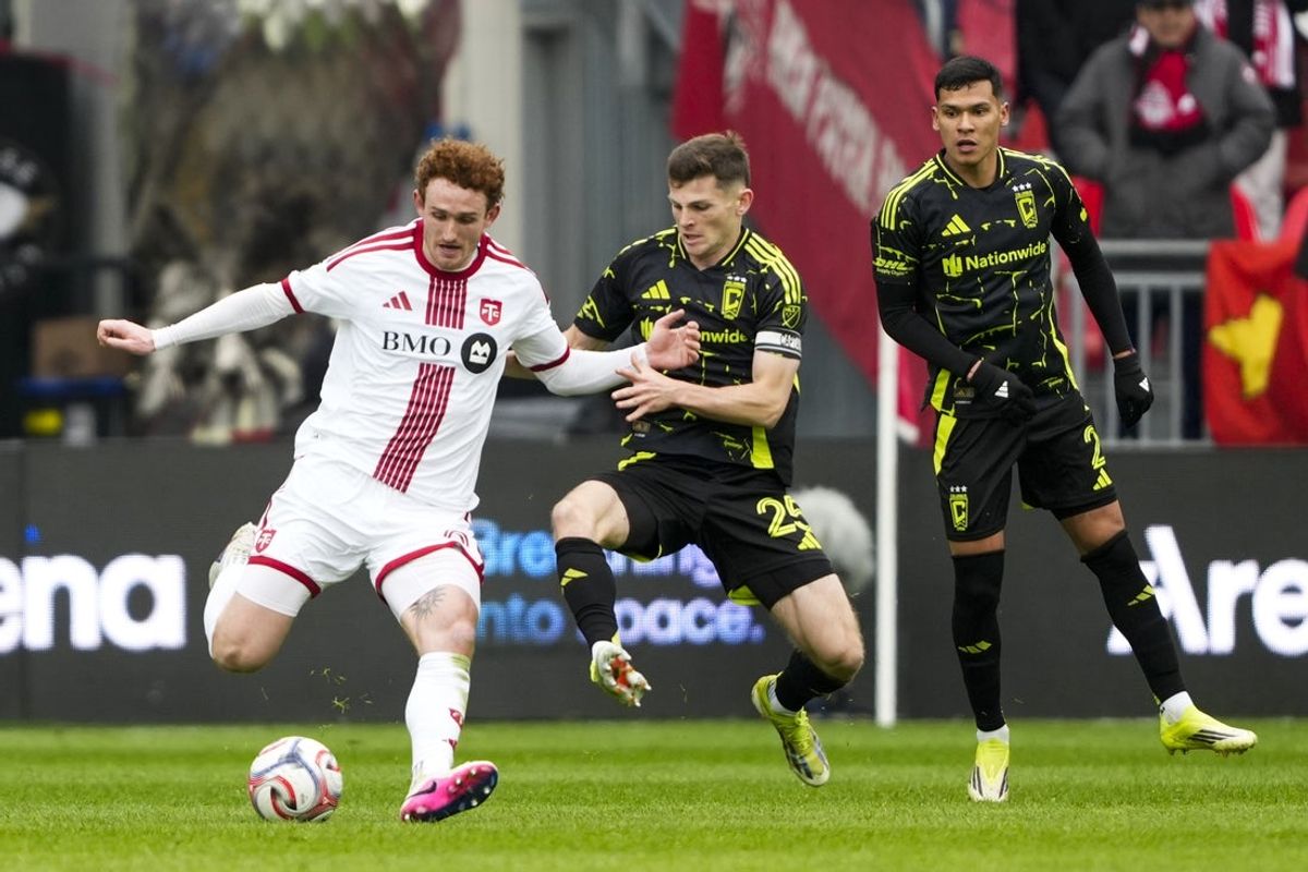 Mar 21, 2026; Toronto, Ontario, CAN;  Toronto FC forward Josh Sargent (9) dribbles the ball against Columbus Crew midfielder Sean Zawadzki (25) during the first half at BMO Field. Mandatory Credit: Kevin Sousa-Imagn Images