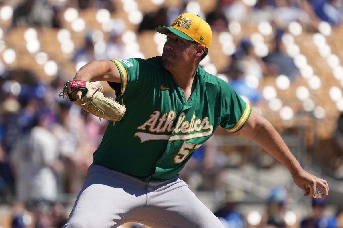 Mar 21, 2026; Phoenix, Arizona, USA; Athletics pitcher Jacob Lopez (57) throws against the Los Angeles Dodgers in the first inning at Camelback Ranch-Glendale. Mandatory Credit: Rick Scuteri-Imagn Images