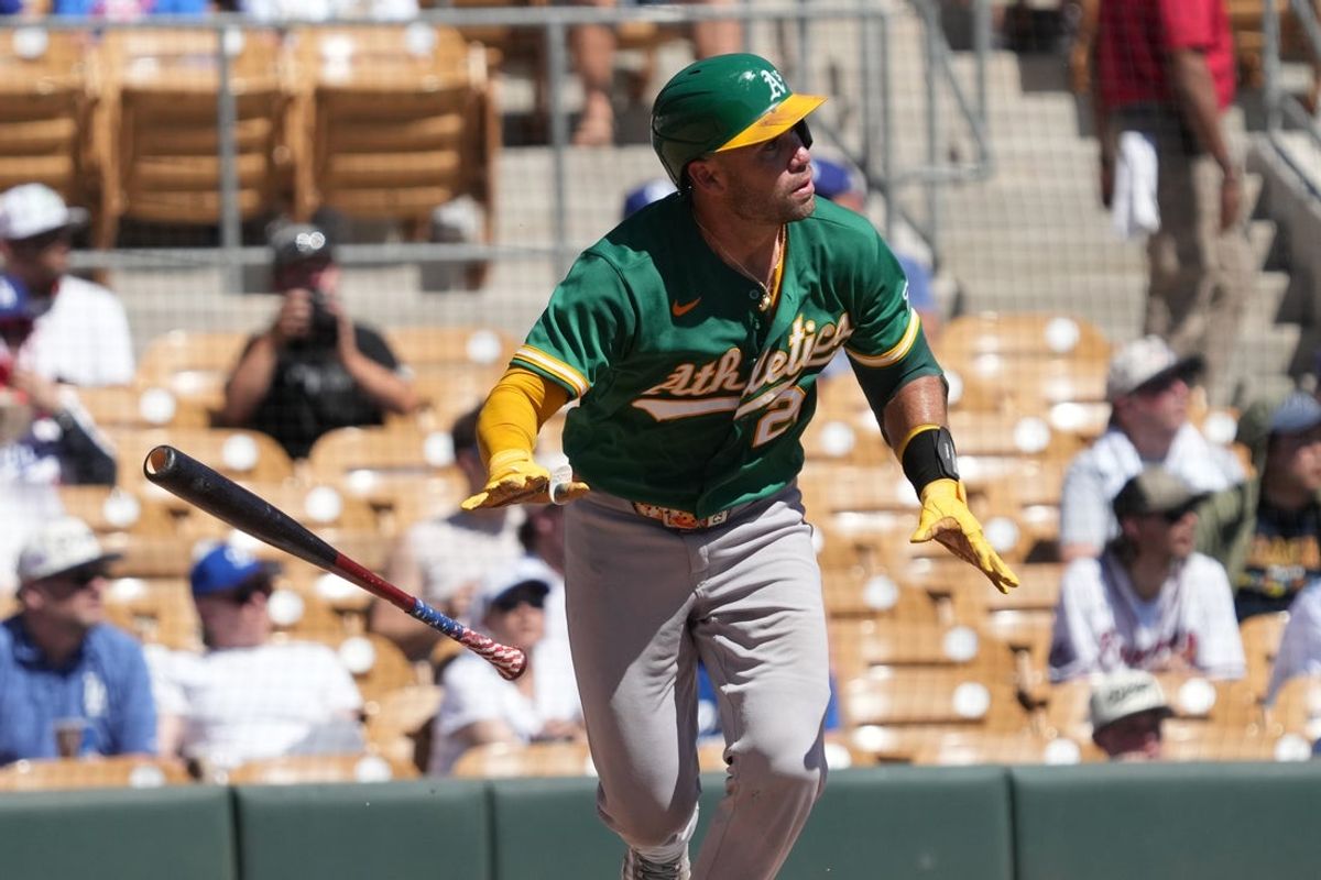 Mar 21, 2026; Phoenix, Arizona, USA; Athletics catcher Austin Wynns (29) hits against the Los Angeles Dodgers in the second inning at Camelback Ranch-Glendale. Mandatory Credit: Rick Scuteri-Imagn Images