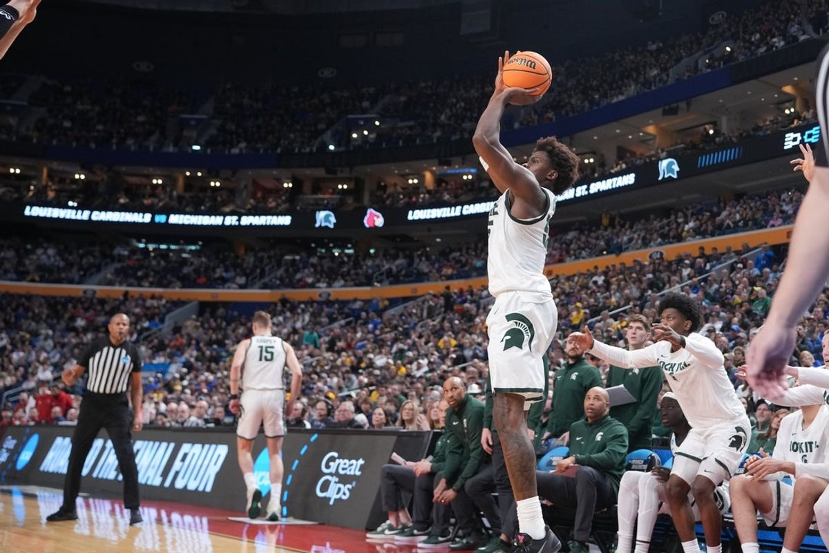 Mar 21, 2026; Buffalo, NY, USA; Michigan State Spartans forward Coen Carr (55) shoots in the second half against the Louisville Cardinals during a second round game of the men's 2026 NCAA Tournament at Keybank Center. Mandatory Credit: Gregory Fisher-Imagn Images