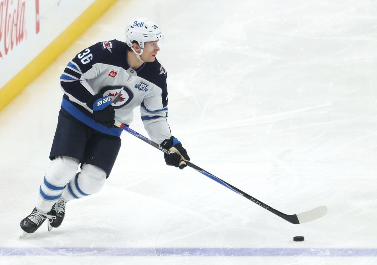 Mar 21, 2026; Pittsburgh, Pennsylvania, USA;  Winnipeg Jets center Morgan Barron (36) skates with the puck against the Pittsburgh Penguins during the third period at PPG Paints Arena. Mandatory Credit: Charles LeClaire-Imagn Images