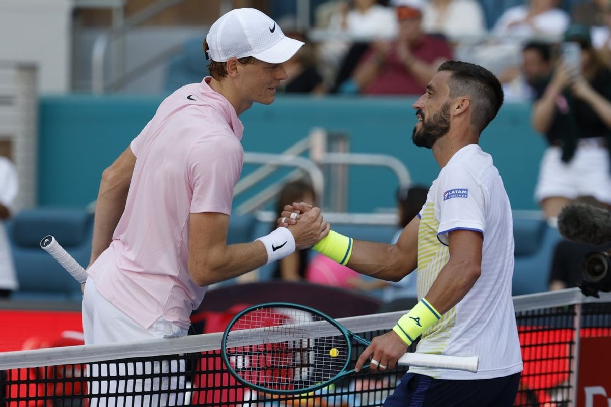 Mar 21, 2026; Miami Gardens, FL, USA; Jannik Sinner (ITA) (L) shakes hands with Damir D?umhur (BIH) (R) at the net after their match on day five of the 2026 Miami Open at Hard Rock Stadium. Mandatory Credit: Geoff Burke-Imagn Images