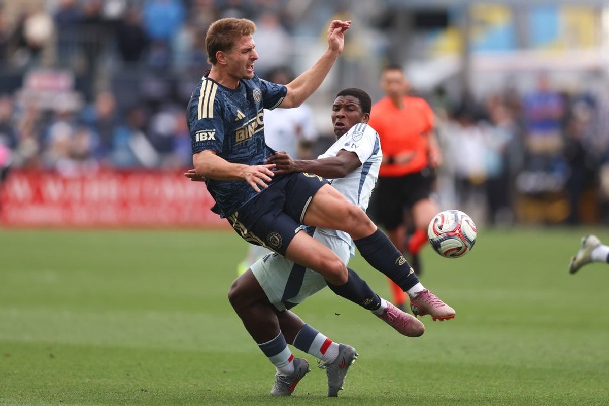Mar 21, 2026; Chester, Pennsylvania, USA; Philadelphia Union forward Bruno Damiani (9) is tripped up by Chicago Fire defender Mbekezeli Mbokazi (4) while going for the ball during the first half at Subaru Park. Mandatory Credit: Bill Streicher-Imagn Images
