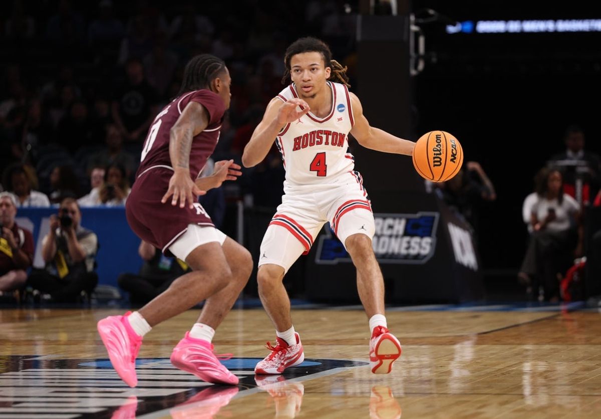 Mar 21, 2026; Oklahoma City, OK, USA; Houston Cougars guard Kingston Flemings (4) drives to the hoop past Texas A&M Aggies guard Marcus Hill (0) during the first half of a second round game of the men's 2026 NCAA Tournament at Paycom Center. Mandatory Credit: William Purnell-Imagn Images