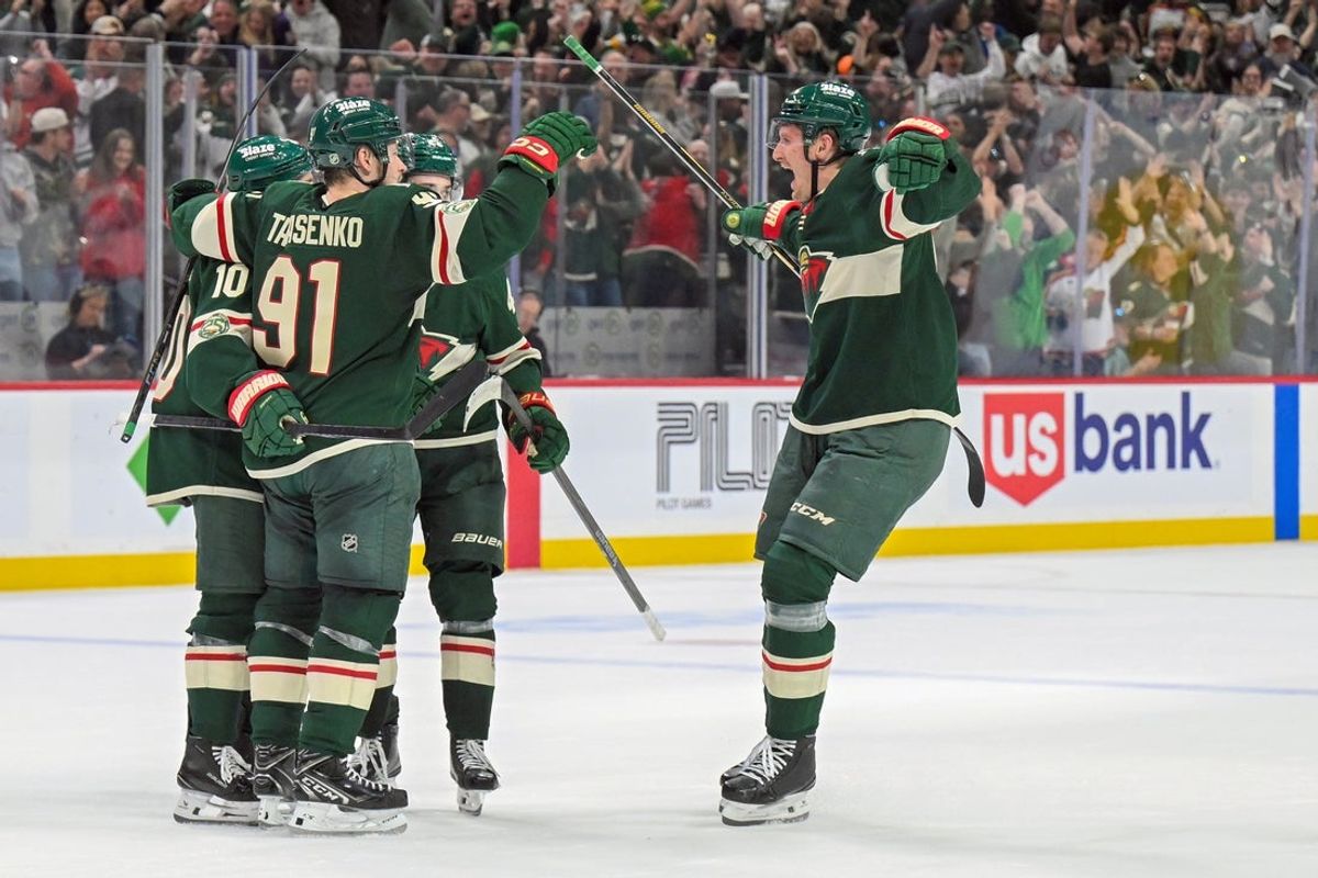 Mar 21, 2026; Saint Paul, Minnesota, USA;  Minnesota Wild forward Micael McCarron (47) skates in to congratulate forward Vladimir Tarasenko (91) on his overtime game-winning goal against the Dallas Stars at Grand Casino Arena. Mandatory Credit: Nick Wosika-Imagn Images