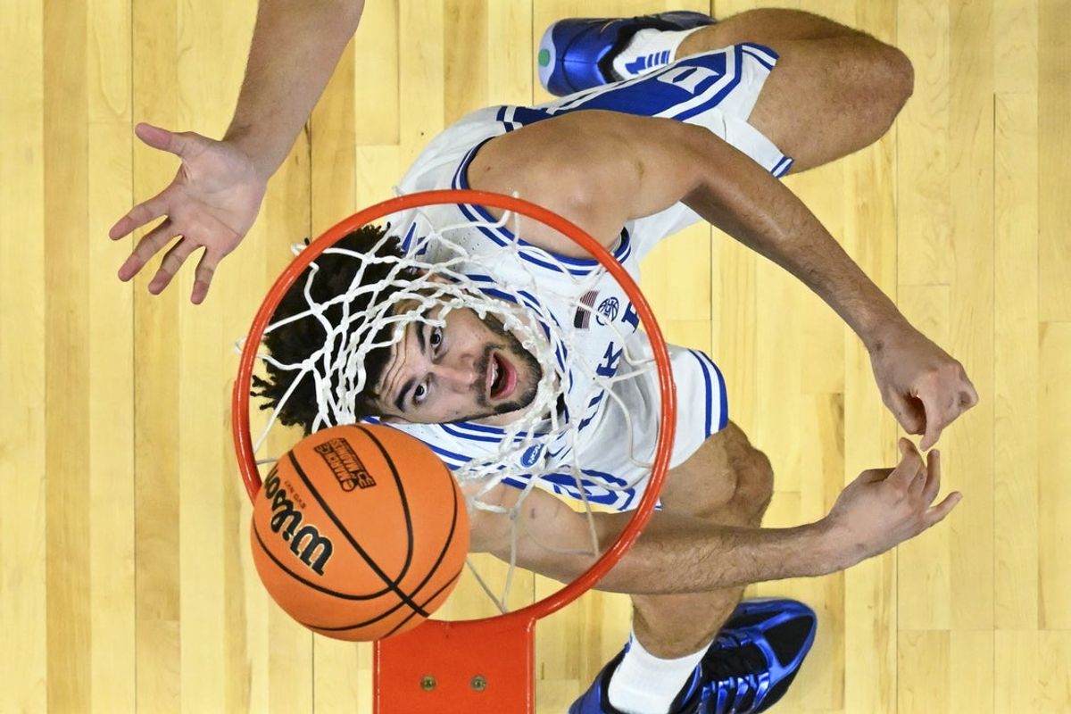 Mar 21, 2026; Greenville, SC, USA; Duke Blue Devils forward Cameron Boozer (12) scores a basket during the second half against the Texas Christian University Horned Frogs during a second round game of the men's 2026 NCAA Tournament at Bon Secours Wellness Arena. Mandatory Credit: Bob Donnan-Imagn Images