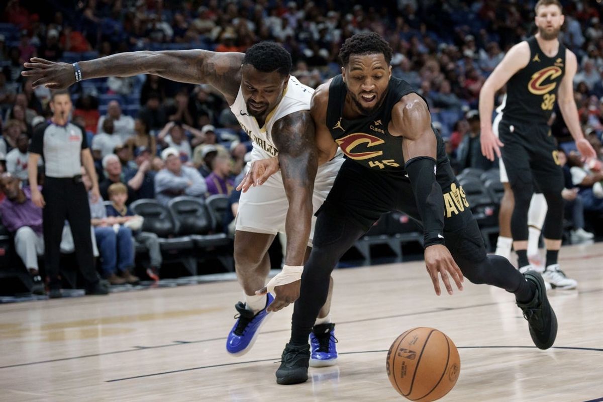 Mar 21, 2026; New Orleans, Louisiana, USA;  New Orleans Pelicans forward Zion Williamson (1) battles Cleveland Cavaliers guard Donovan Mitchell (45) during the first half at Smoothie King Center. Mandatory Credit: Matthew Hinton-Imagn Images
