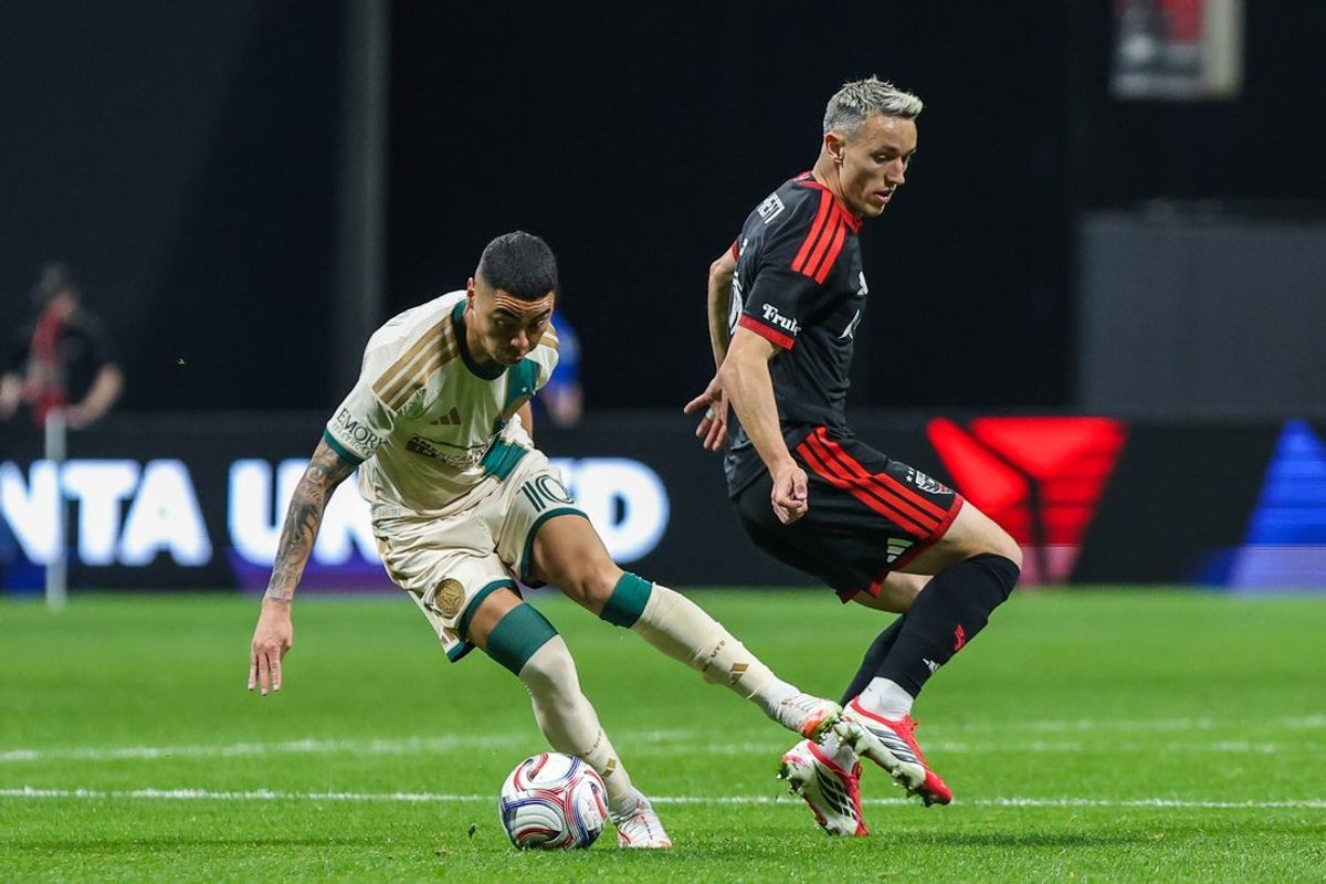 Mar 21, 2026; Atlanta, Georgia, USA; Atlanta United midfielder Miguel Almirón (10) steals the ball against D.C. United defender Silvan Hefti (5) during the first half at Mercedes-Benz Stadium. Mandatory Credit: Jordan Godfree-Imagn Images