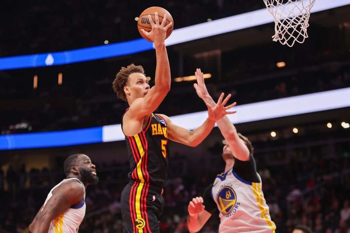 Mar 21, 2026; Atlanta, Georgia, USA; Atlanta Hawks guard Dyson Daniels (5) shoots against the Golden State Warriors in the first quarter at State Farm Arena. Mandatory Credit: Brett Davis-Imagn Images