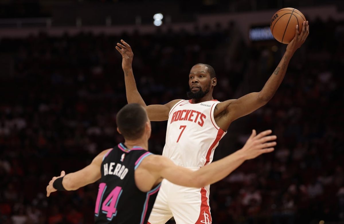 Mar 21, 2026; Houston, Texas, USA; Houston Rockets forward Kevin Durant (7) catches a pass against Miami Heat guard Tyler Herro (14)  in the first quarter at Toyota Center. Mandatory Credit: Thomas Shea-Imagn Images
