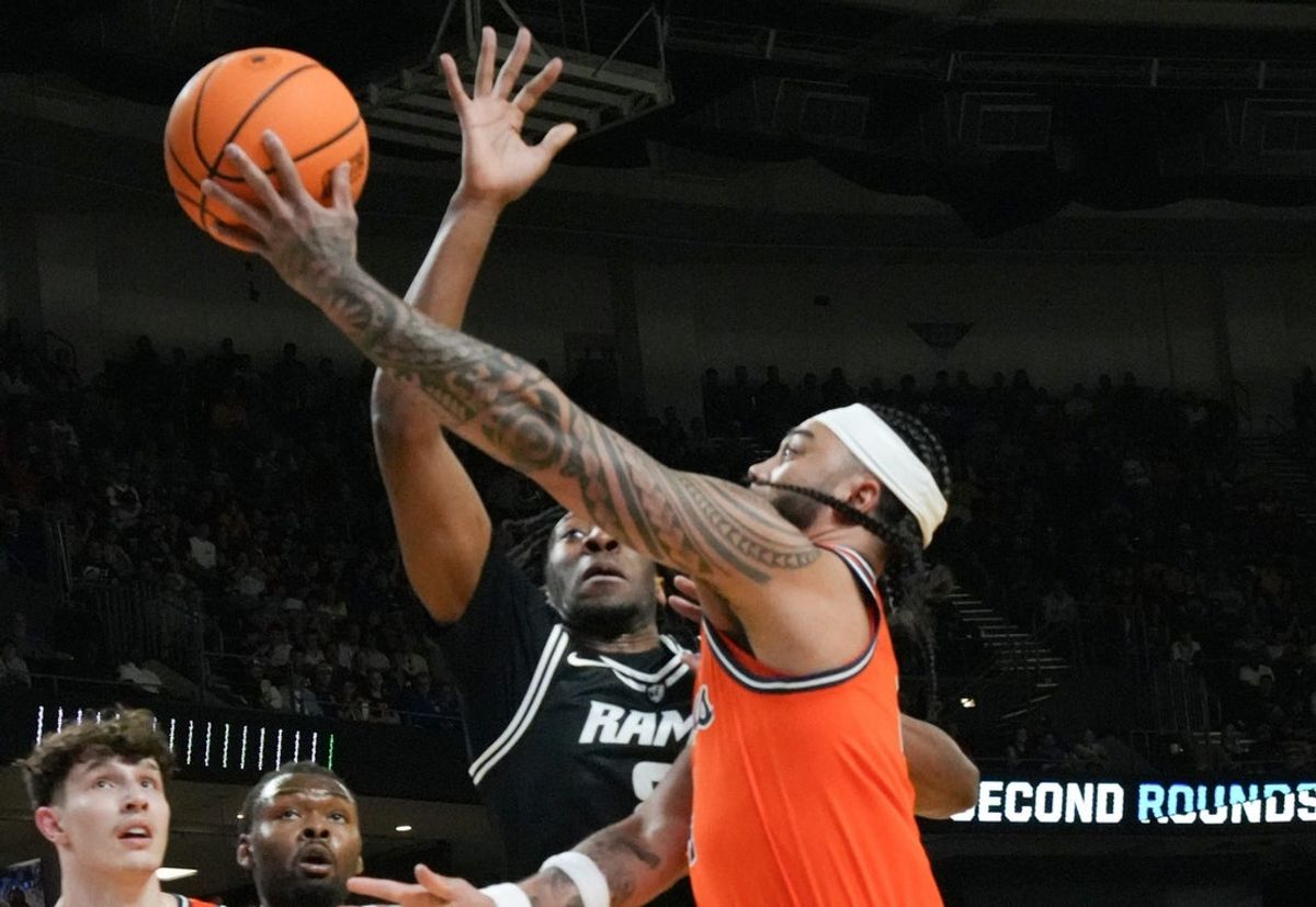 Illinois Fighting Illini guard Kylan Boswell (4) scores near VCU Rams forward Michael Belle (8) March 21, 2026 during the first half of the NCAA Men’s Basketball Tournament second round East Region game at the Bon Secours Wellness Arena in Greenville, South Carolina.