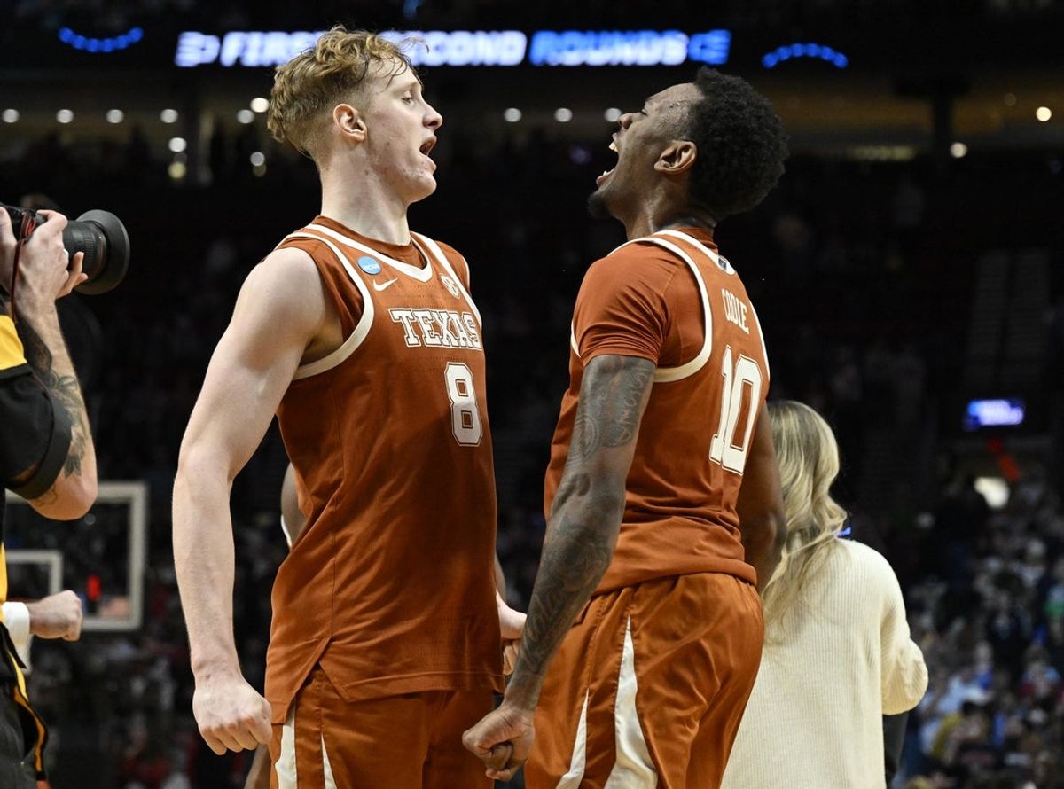 Mar 21, 2026; Portland, OR, USA; Texas Longhorns center Matas Vokietaitis (8) and forward Nic Codie (10) react after defeating the Gonzaga Bulldogs during a second round game of the men's 2026 NCAA Tournament at Moda Center. Mandatory Credit: Troy Wayrynen-Imagn Images