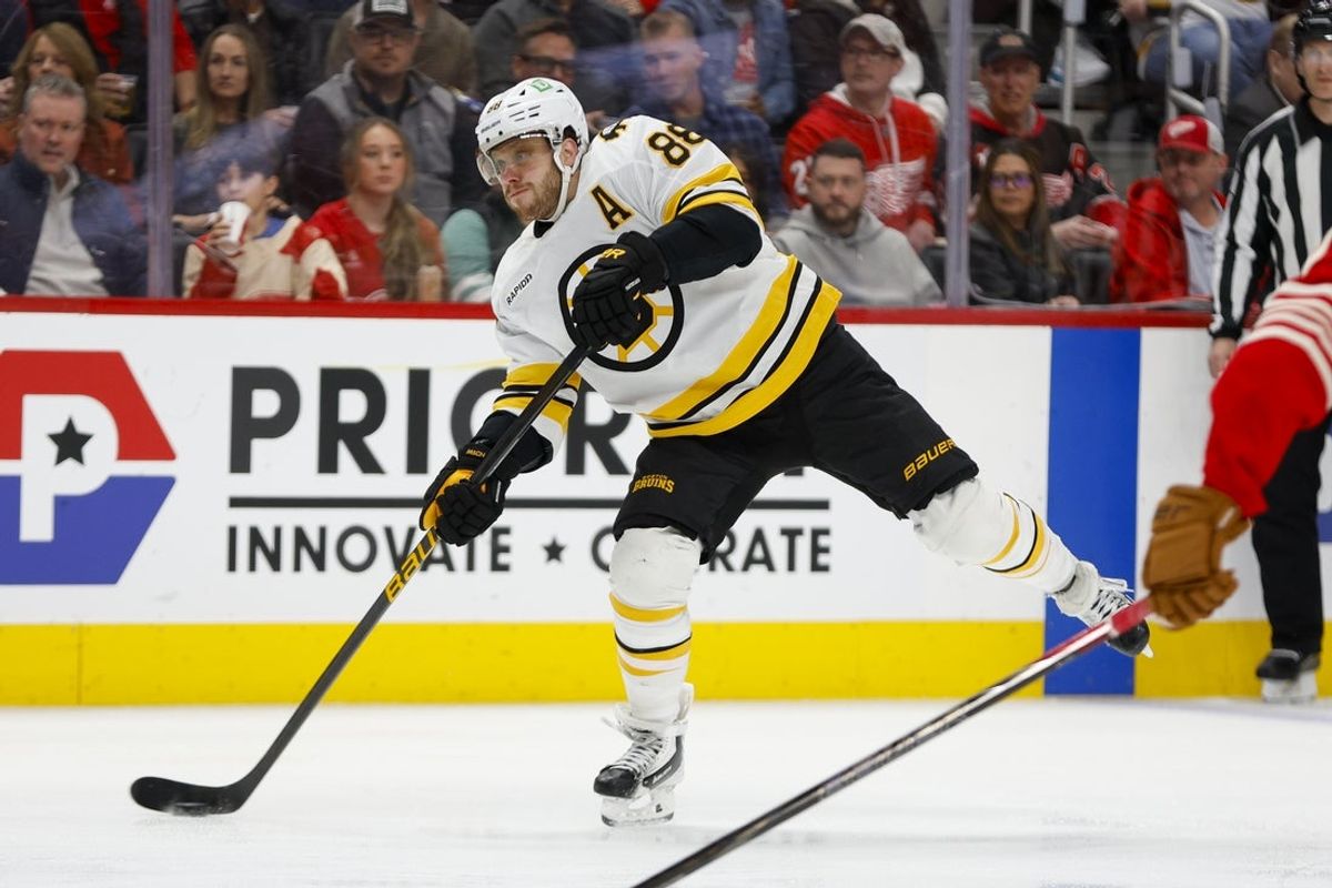 Mar 21, 2026; Detroit, Michigan, USA; Boston Bruins right wing David Pastrnak (88) shoots the puck during the first period against the Detroit Red Wings at Little Caesars Arena. Mandatory Credit: Brian Bradshaw Sevald-Imagn Images