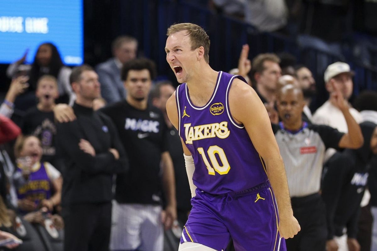 Mar 21, 2026; Orlando, Florida, USA; Los Angeles Lakers guard Luke Kennard (10) reacts after hitting a game winning basket at the buzzer against the Orlando Magic in the fourth quarter at Kia Center. Mandatory Credit: Nathan Ray Seebeck-Imagn Images