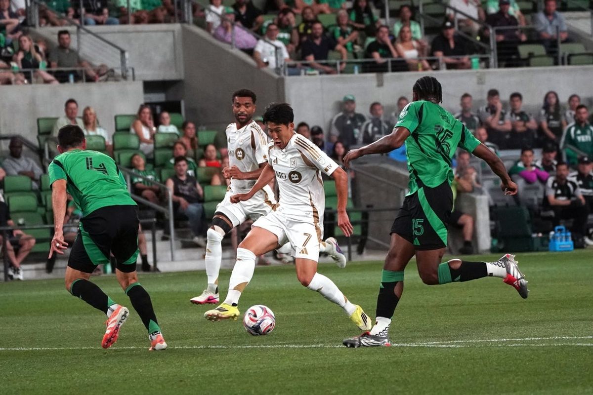 Mar 21, 2026; Austin, Texas, USA;  LAFC forward Son Heung-Min (7) drives the ball against Austin FC defender Brendan Hines-Ike (4) during the first half at Q2 Stadium. Mandatory Credit: Dustin Safranek-Imagn Images