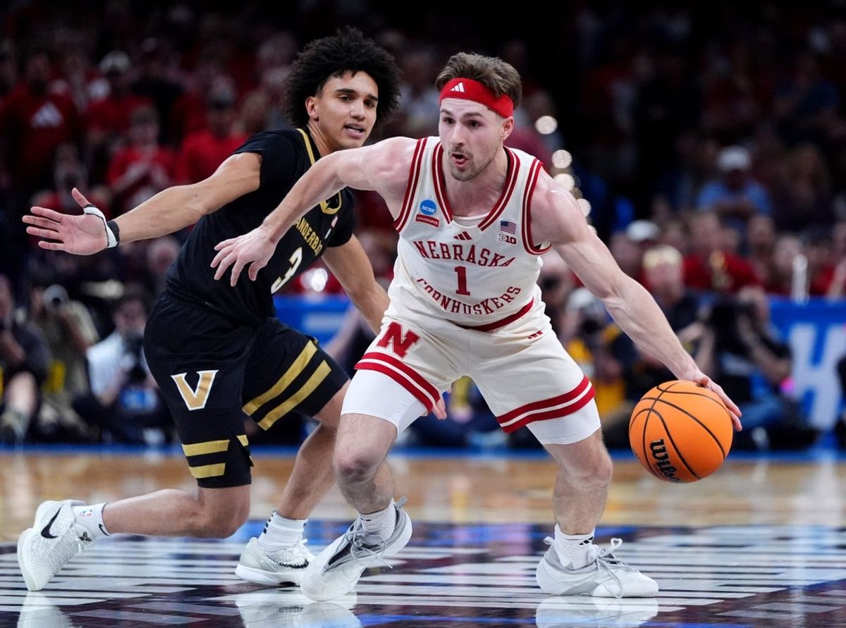 Nebraska's Sam Hoiberg (1) drives up court as Vanderbilt's Tyler Tanner (3) defneds during a second-round game in the NCAA men's basketball tournament between Nebraska Cornhuskers and Vanderbilt Commodores at Paycom Center in Oklahoma City, Saturday March 21, 2026.