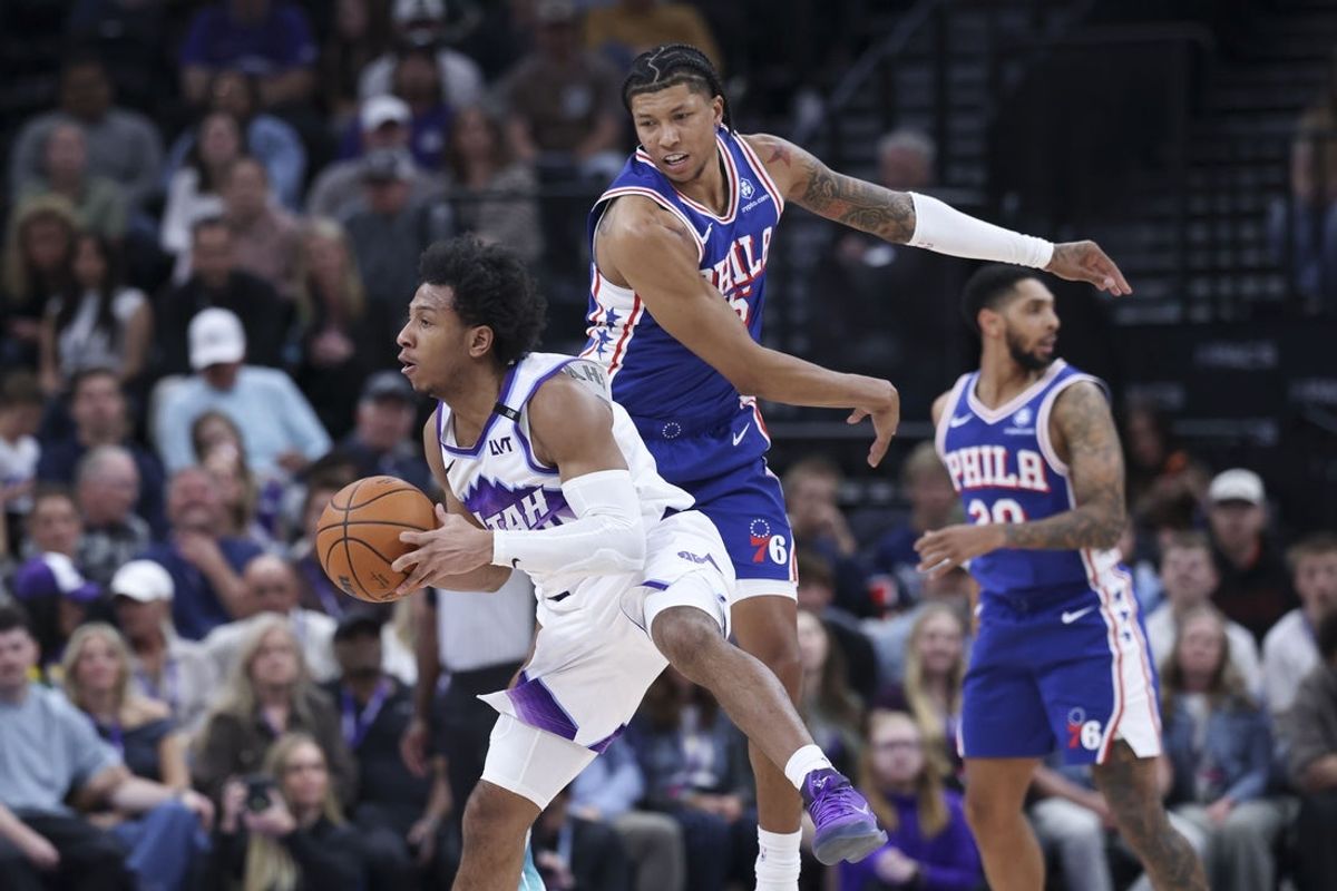 Mar 21, 2026; Salt Lake City, Utah, USA; Utah Jazz guard Kennedy Chandler (0) plays the ball as Philadelphia 76ers forward Marjon Beauchamp (16) defends during the first half at Delta Center. Mandatory Credit: Rob Gray-Imagn Images