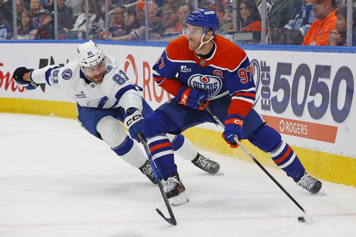 Mar 21, 2026; Edmonton, Alberta, CAN; Edmonton Oilers forward Connor McDavid (97) looks to make a pass in front of Tampa Bay Lightning defensemen Erik Cernak (81) during the first period at Rogers Place. Mandatory Credit: Perry Nelson-Imagn Images