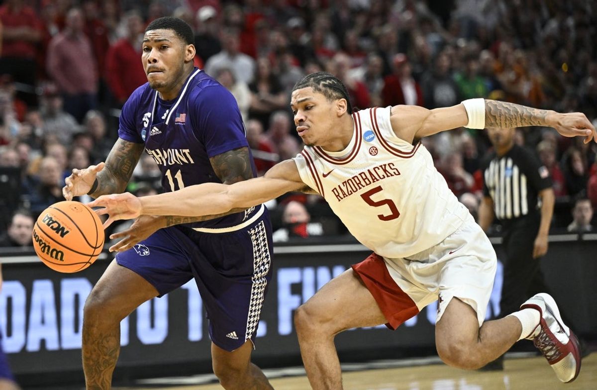Mar 21, 2026; Portland, OR, USA; Arkansas Razorbacks guard Darius Acuff Jr. (5) defends High Point Panthers forward Cam'ron Fletcher (11) in the second half during a second round game of the men's 2026 NCAA Tournament at Moda Center. Mandatory Credit: Craig Strobeck-Imagn Images