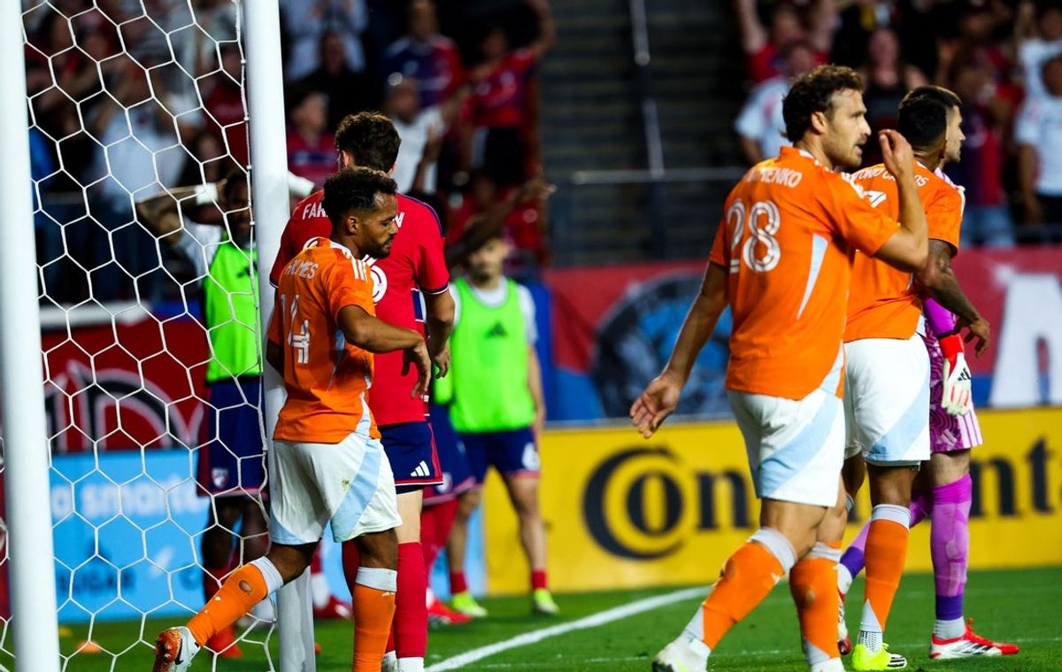 Mar 21, 2026; Frisco, Texas, USA;  Houston Dynamo midfielder Duane Holmes (14) reacts after kicking the ball into his own net resulting in an own goal during the second half against FC Dallas at Toyota Stadium. Mandatory Credit: Kevin Jairaj-Imagn Images