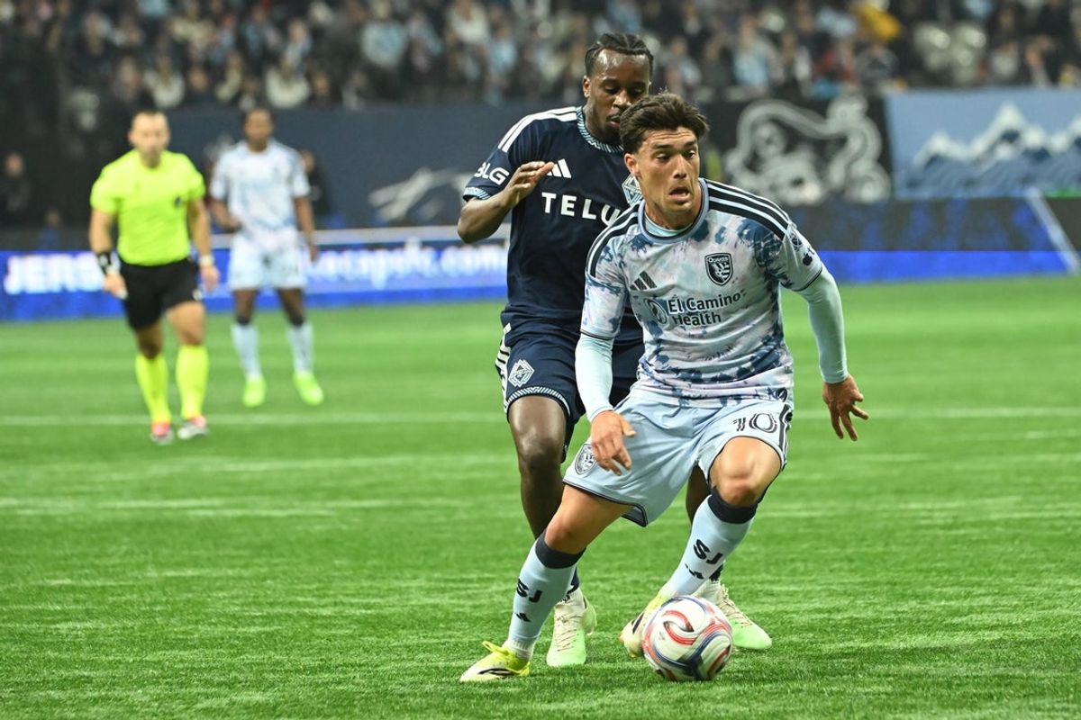 Mar 21, 2026; Vancouver, British Columbia, CAN;  San Jose Earthquakes midfielder Niko Tsakiris (10) controls the ball against Vancouver Whitecaps FC midfielder Jean-Claude Ngando (26) during the first half at BC Place. Mandatory Credit: Simon Fearn-Imagn Images