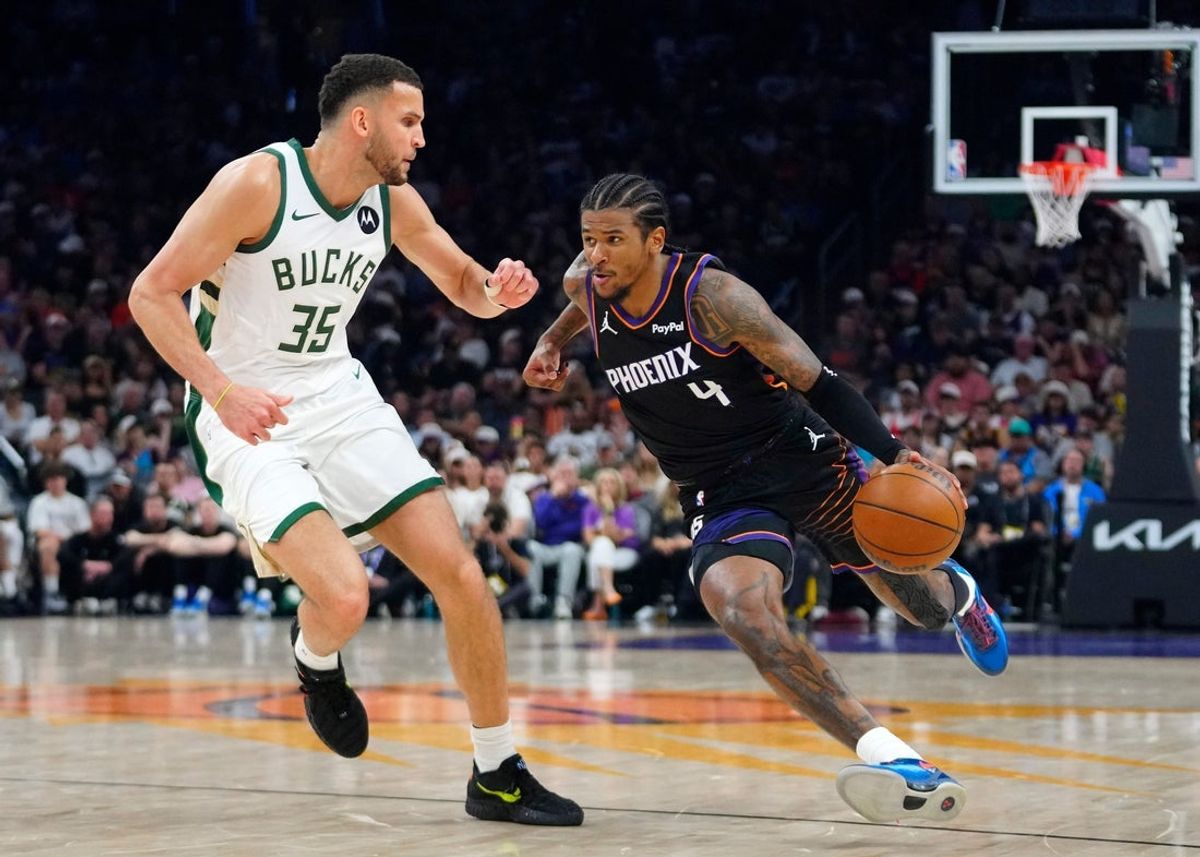 Suns guard Jalen Green (4) drives against Bucks forward Pete Nance (35) during a game at the Mortgage Matchup Center in Phoenix on March 21, 2026.