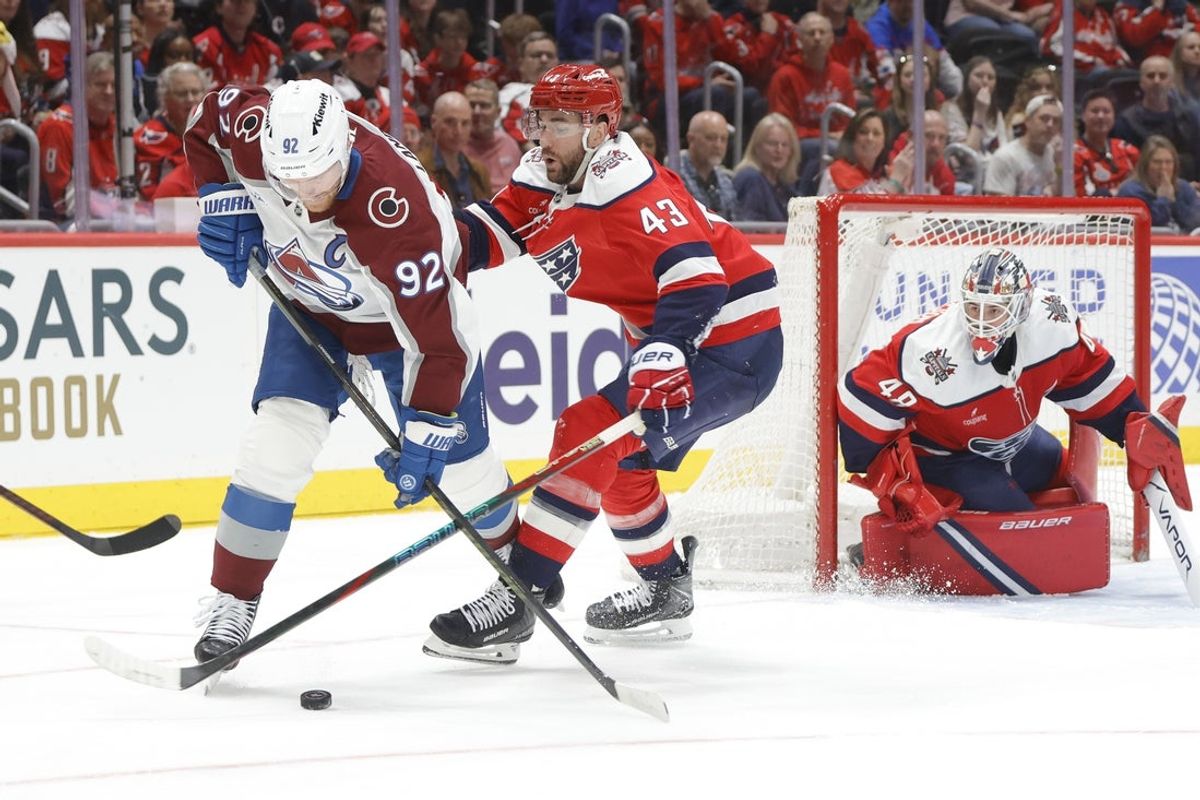 Mar 22, 2026; Washington, District of Columbia, USA; Colorado Avalanche left wing Gabriel Landeskog (92) battles for the puck with Washington Capitals right wing Tom Wilson (43) in front of Capitals goaltender Logan Thompson (48) during the second period at Capital One Arena. Mandatory Credit: Amber Searls-Imagn Images