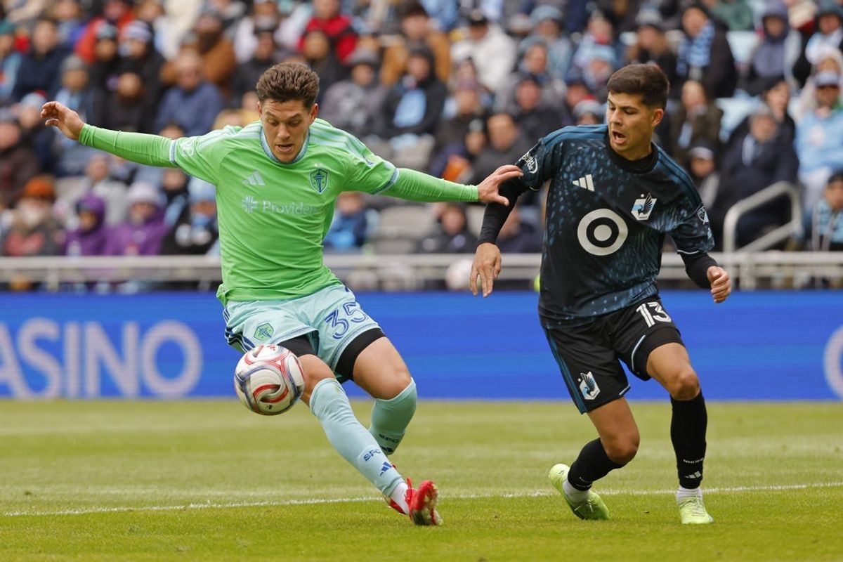 Mar 22, 2026; Saint Paul, Minnesota, USA; Seattle Sounders FC defender Antino Lopez (35) keeps the ball from Minnesota United FC defender Anthony Markanich (13) in the first half at Allianz Field. Mandatory Credit: Bruce Kluckhohn-Imagn Images