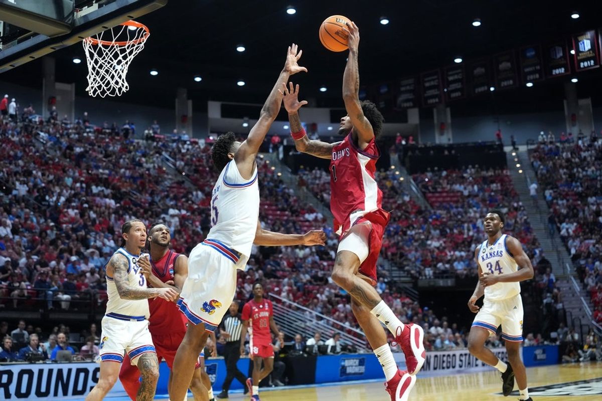 Mar 22, 2026; San Diego, CA, USA; St. John's Red Storm forward Dillon Mitchell (1) shoots against Kansas Jayhawks forward Bryson Tiller (15) in the first half during a second round game of the men's 2026 NCAA Tournament at Viejas Arena. Mandatory Credit: Kirby Lee-Imagn Images