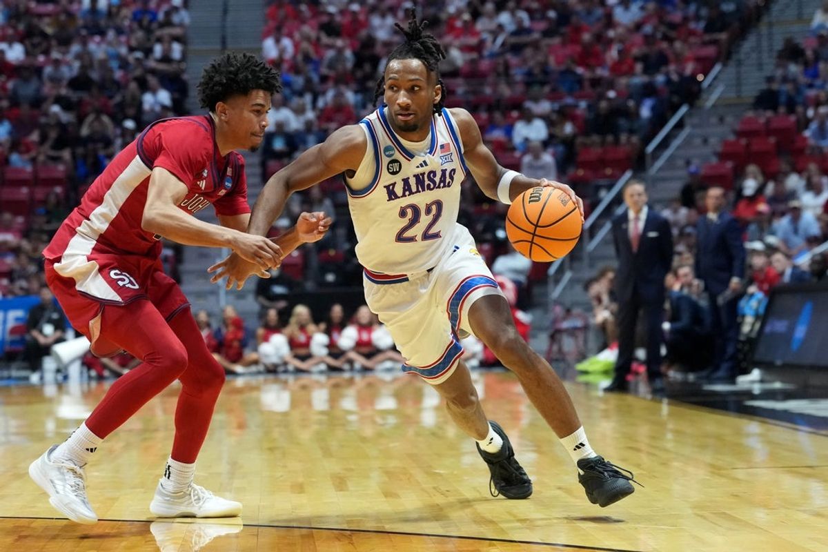 Mar 22, 2026; San Diego, CA, USA; Kansas Jayhawks guard Darryn Peterson (22) controls the ball against St. John's Red Storm guard Oziyah Sellers (4) in the second half during a second round game of the men's 2026 NCAA Tournament at Viejas Arena. Mandatory Credit: Kirby Lee-Imagn Images